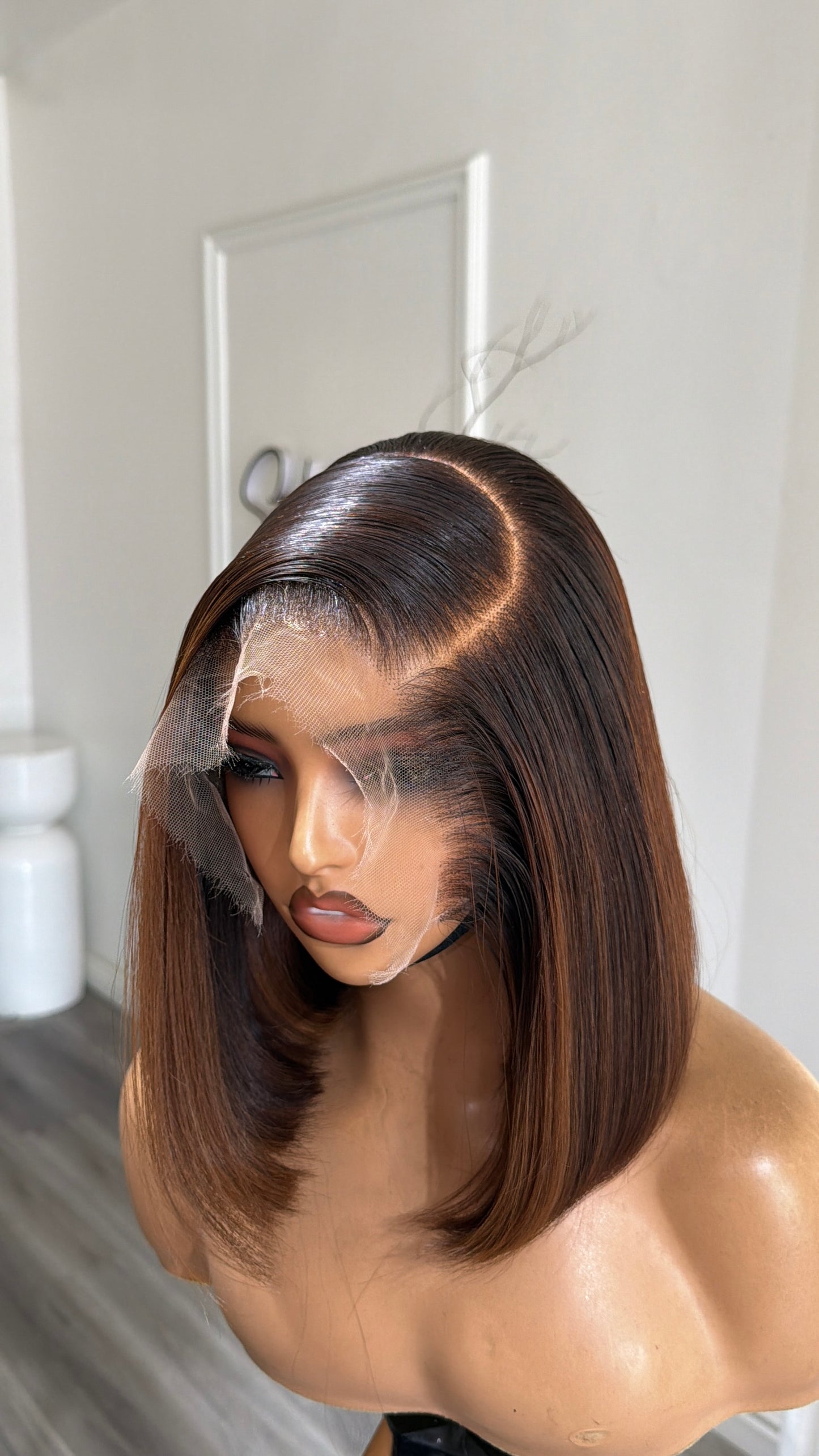 Side view of the Brown Mix Bob raw human hair wig featuring a 9x6 HD lace closure, 10–12-inch bob cut, and a natural brown blended finish.