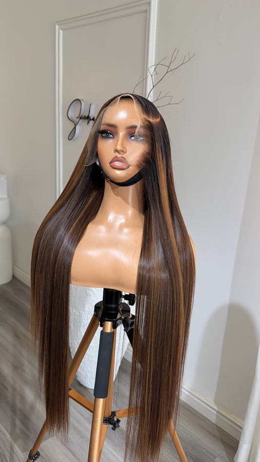 Brown Mix Raw Human Hair Wig with a 13x6 HD lace frontal, 28-inch length and rich brown blended tones, front view.