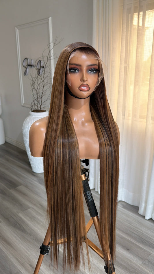 Caramel Luxe Raw Human Hair Wig with a 13x6 HD lace frontal or 6x6 HD lace closure, 30-inch length and rich caramel tones, front view.
