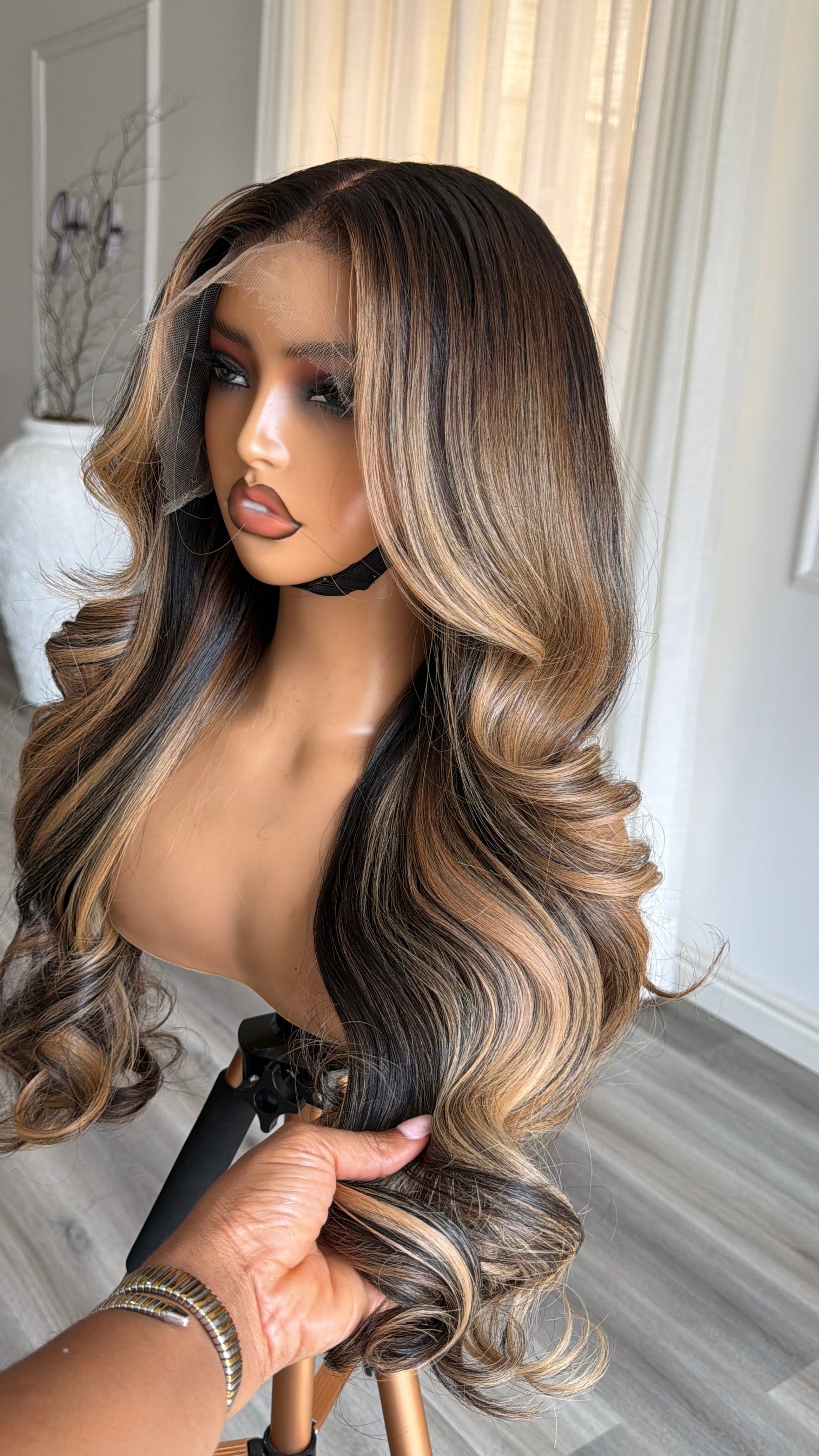 Side view of the Espresso Blonde Raw Human Hair Wig featuring a 13x6 HD lace frontal, 24-inch length and silky espresso blonde strands with a flawless, natural-looking hairline.