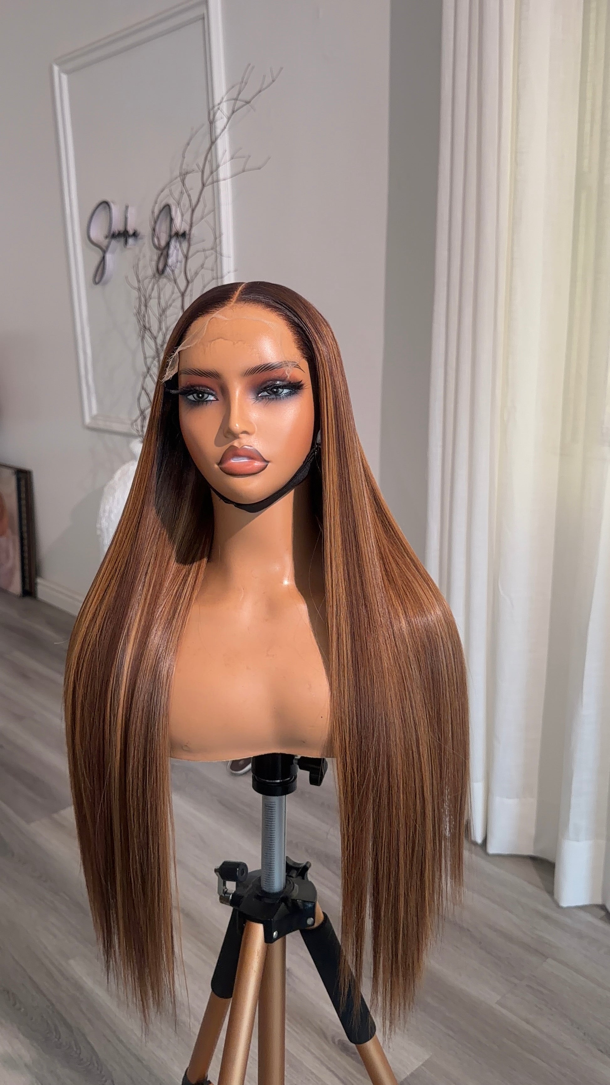 Side view of the Honey Chestnut Raw Human Hair Wig featuring a 6x6 HD lace closure, 22-inch length and silky honey chestnut strands with a seamless, natural-looking hairline.