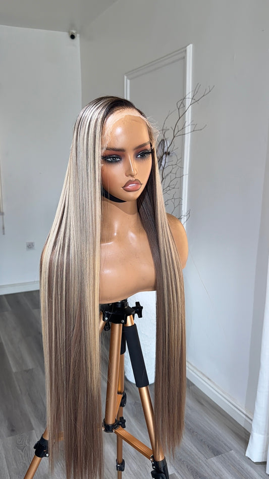 Ice Mocha Blonde Raw Human Hair Wig with a 9x6 HD lace closure, 30-inch length and cool blonde tones with mocha dimension, front view.