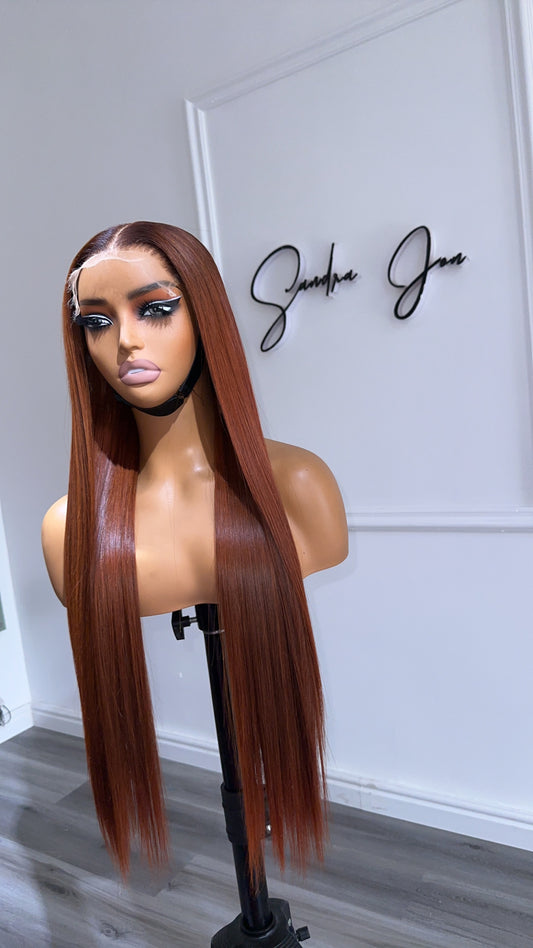Rich Auburn Straight Raw Human Hair Wig with a 6x6 HD lace closure, 24-inch length and vibrant auburn color, front view.