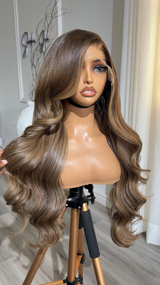Mocha Brunette Raw Human Hair Wig with a 9x6 HD lace closure, 24-inch length and rich mocha brunette tones, front view.
