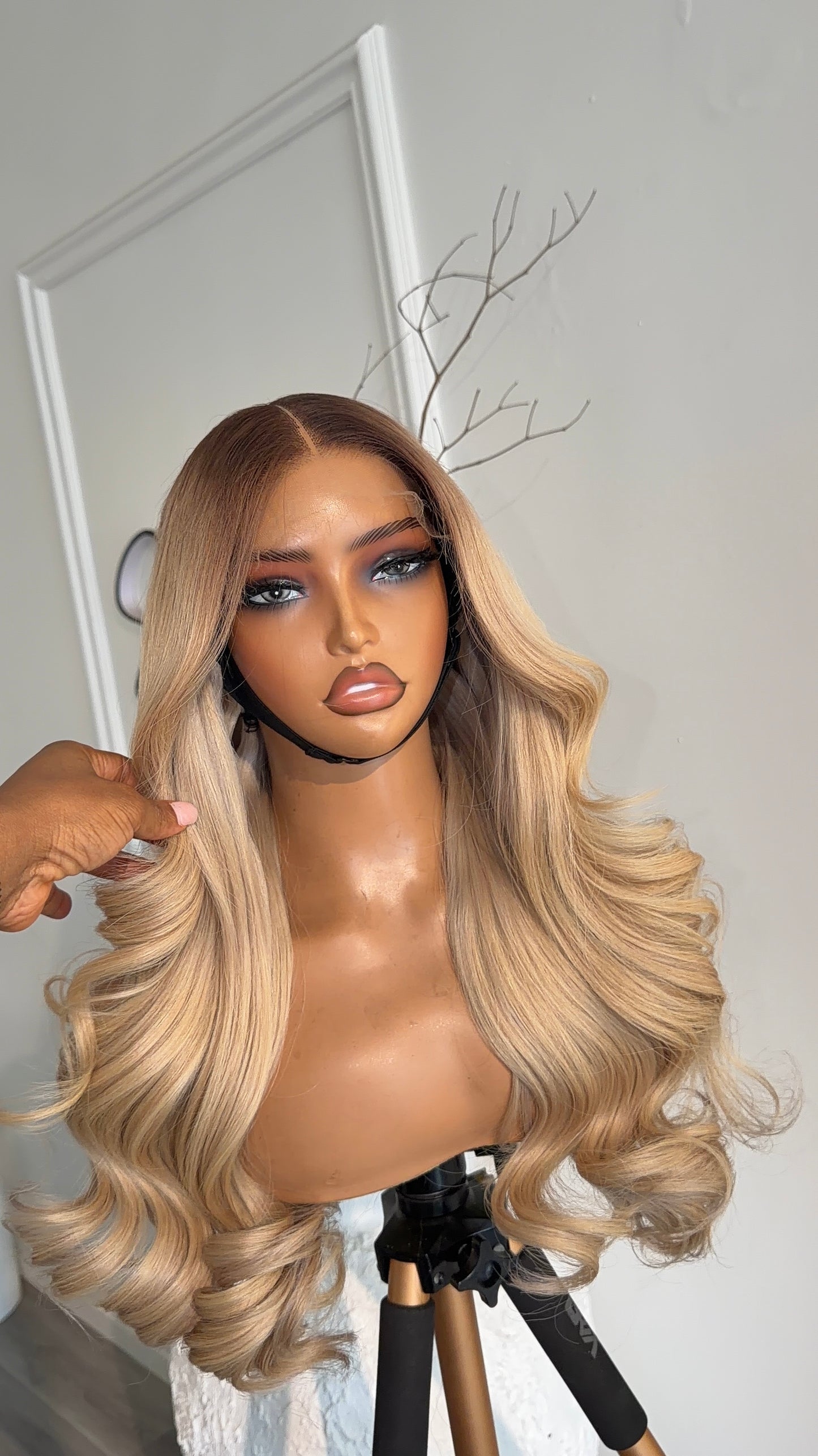 Side view of the Pure Blonde raw human hair wig featuring a 6x6 HD lace closure, 20-inch length and silky blonde strands with a natural-looking hairline.