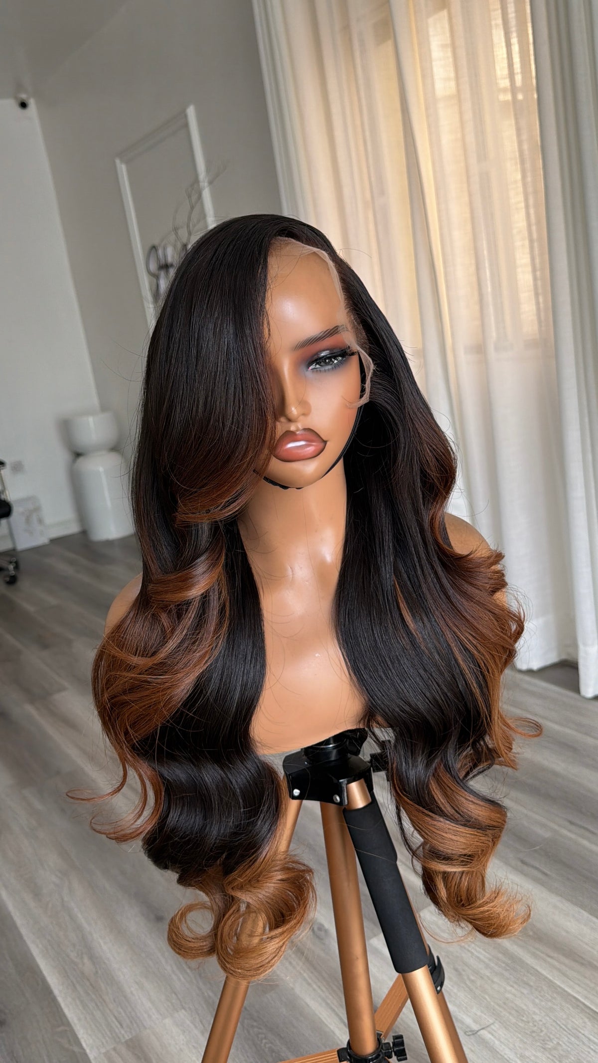 Side view of the Spiced Cocoa Raw Human Hair Wig featuring a 13x6 HD lace frontal, 26-inch length and silky spiced cocoa strands with a flawless, natural-looking hairline.
