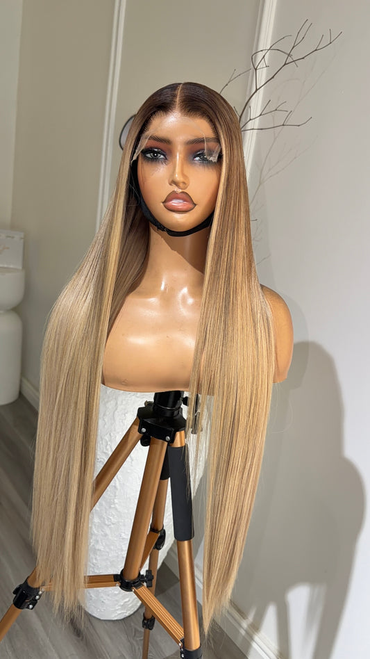 Vanilla Beige Blonde Raw Human Hair Wig with a 6x6 HD lace closure, 26-inch length and soft vanilla beige blonde tones, front view.