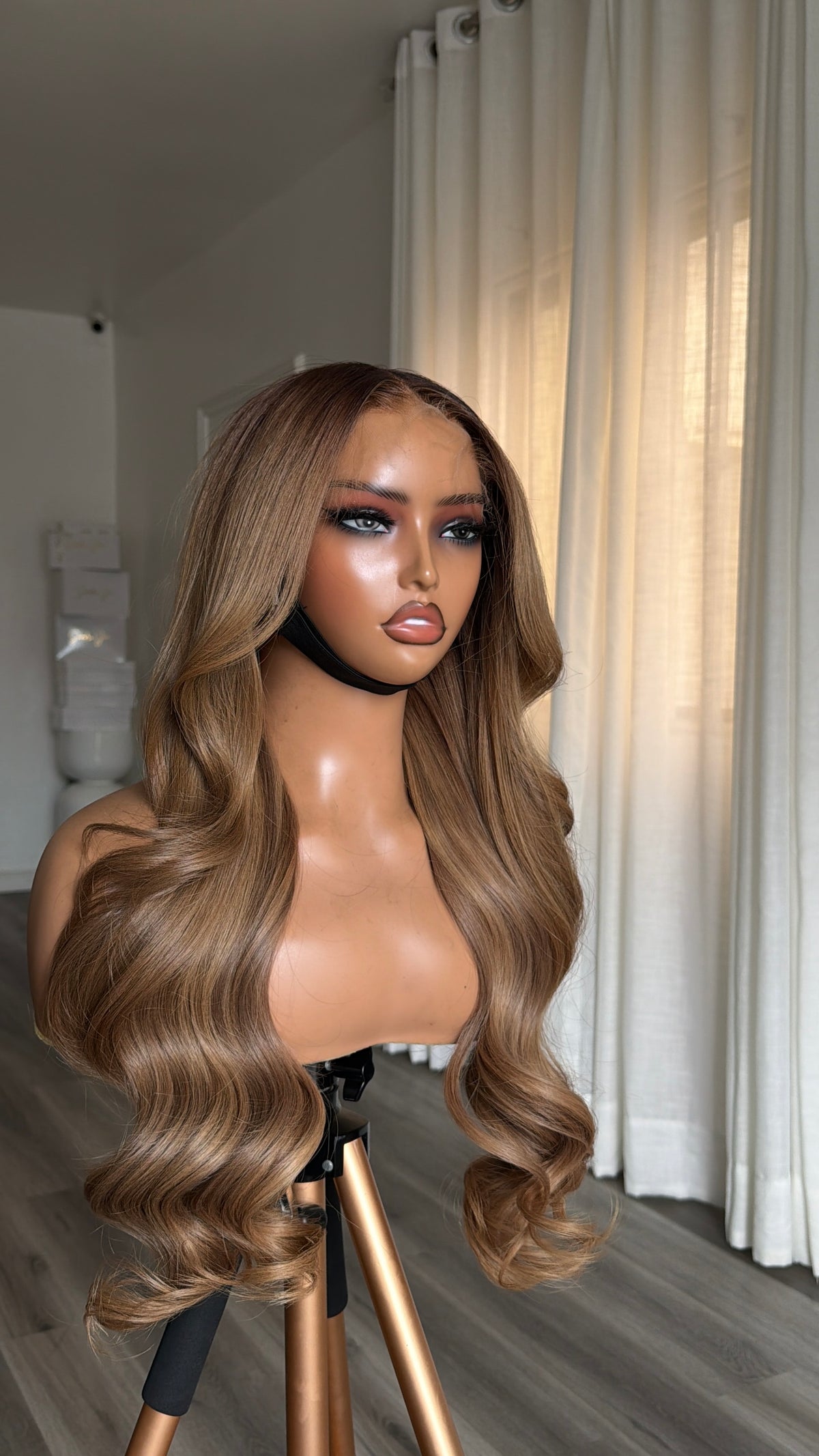 Walnut Blonde Raw Human Hair Wig with a 6x6 HD lace closure, 22-inch length and rich walnut blonde tones, front view.